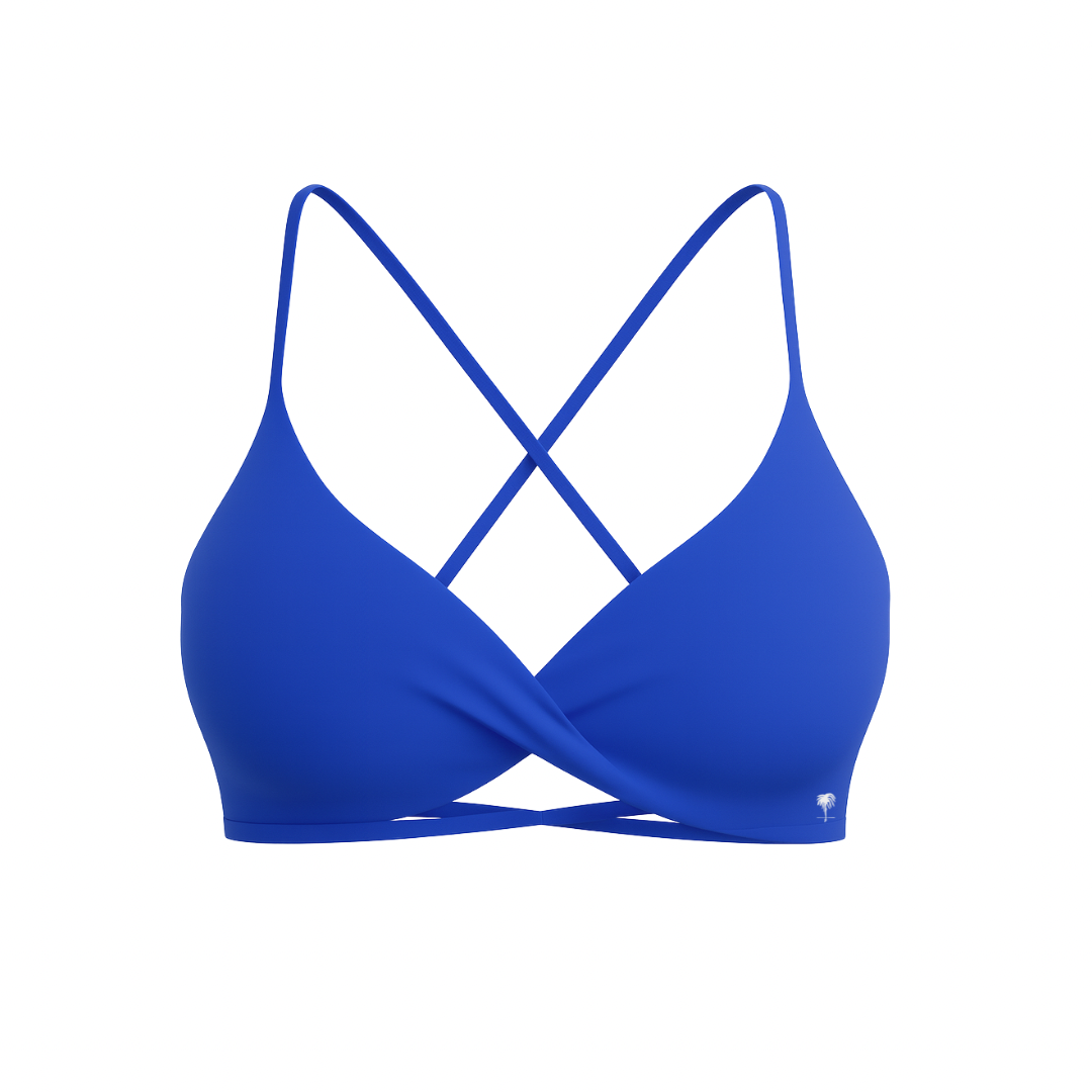 The Palm – CrossFlex™ Bra in blue. Sleek scoop neckline with criss-cross straps and wrap front detail, designed for flexible support and a flattering fit.