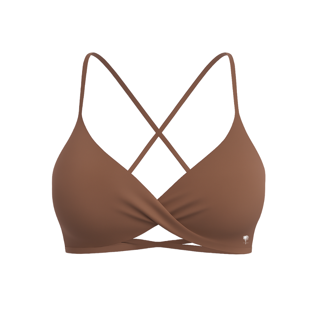 The Palm – CrossFlex™ Bra in brown. Sleek scoop neckline with criss-cross straps and wrap front detail, designed for flexible support and a flattering fit.