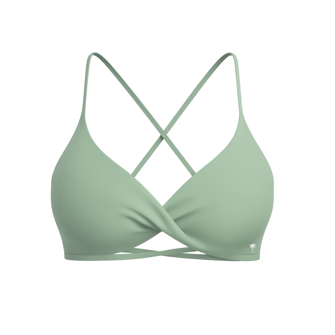 The Palm – CrossFlex™ Bra in mint green. Sleek scoop neckline with criss-cross straps and wrap front detail, designed for flexible support and a flattering fit.