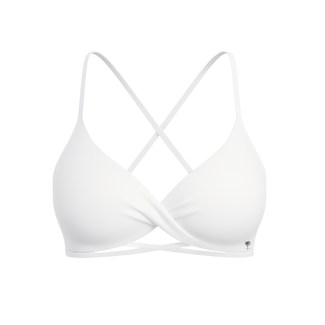 The Palm – CrossFlex™ Bra in white. Sleek scoop neckline with criss-cross straps and wrap front detail, designed for flexible support and a flattering fit.