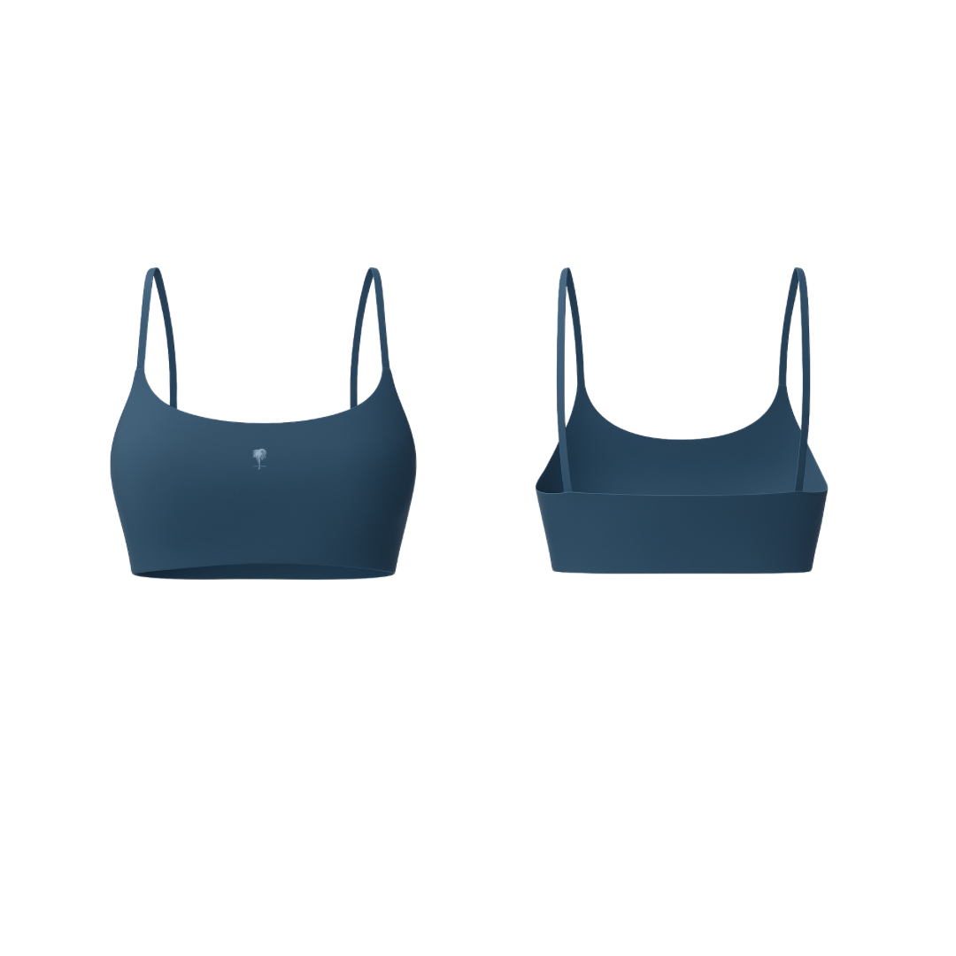 The Palm – FlexForm™ Bra in navy. Minimal seamless design with thin adjustable straps, supportive fit, and sleek scoop neckline.