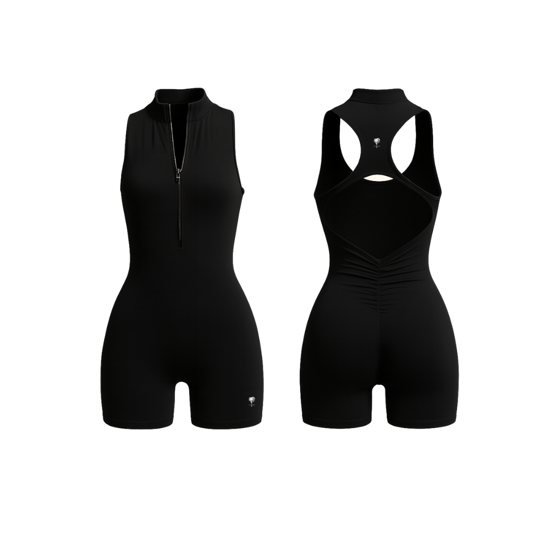 The Palm — SculptZip Romper in black. Sleek, high-neck romper with front zipper and racerback silhouette. Seamless second-skin fit designed to contour, lift, and move with you. Bold, minimal, iconic.