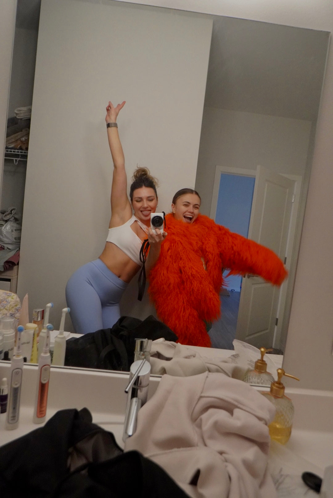 Two women behind the scenes getting ready during a The Palm shoot