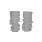 Ivory ribbed knit leg warmers by The Palm, featuring a minimalist logo tag and soft slouchy texture on a silver background1