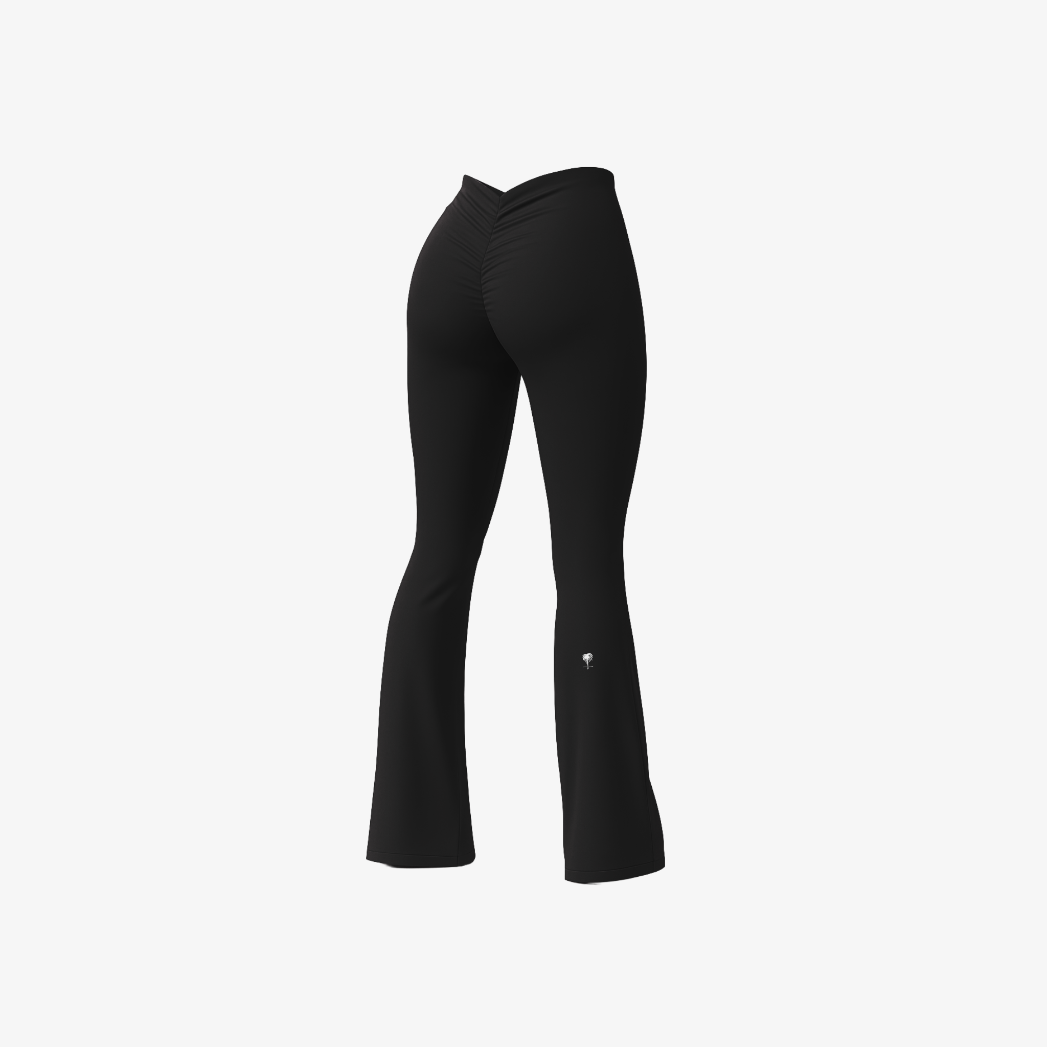 High-waisted Jet Black BootyForm™ flare leggings with a sculpting fit and signature ruched back detail by The Palm.