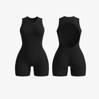 Sleek Jet Black FlowForm™ open-back romper by The Palm, featuring a sculpting second-skin fit and elegant back cutout.