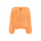 Soft orange faux-fur jacket on a white background — plush texture and relaxed cropped silhouette from The Palm Jackets Collection.
