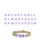 A grid displaying the complete alphabet and special symbols (heart, flower, star, paw) all in lavender, with a separate dog collar showing an example of how the lavender letters are attached to create a personalized name.