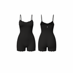Minimalist seamless romper in rich jet black shade with delicate lace trim and subtle Palm embroidery, front and back view on white background.