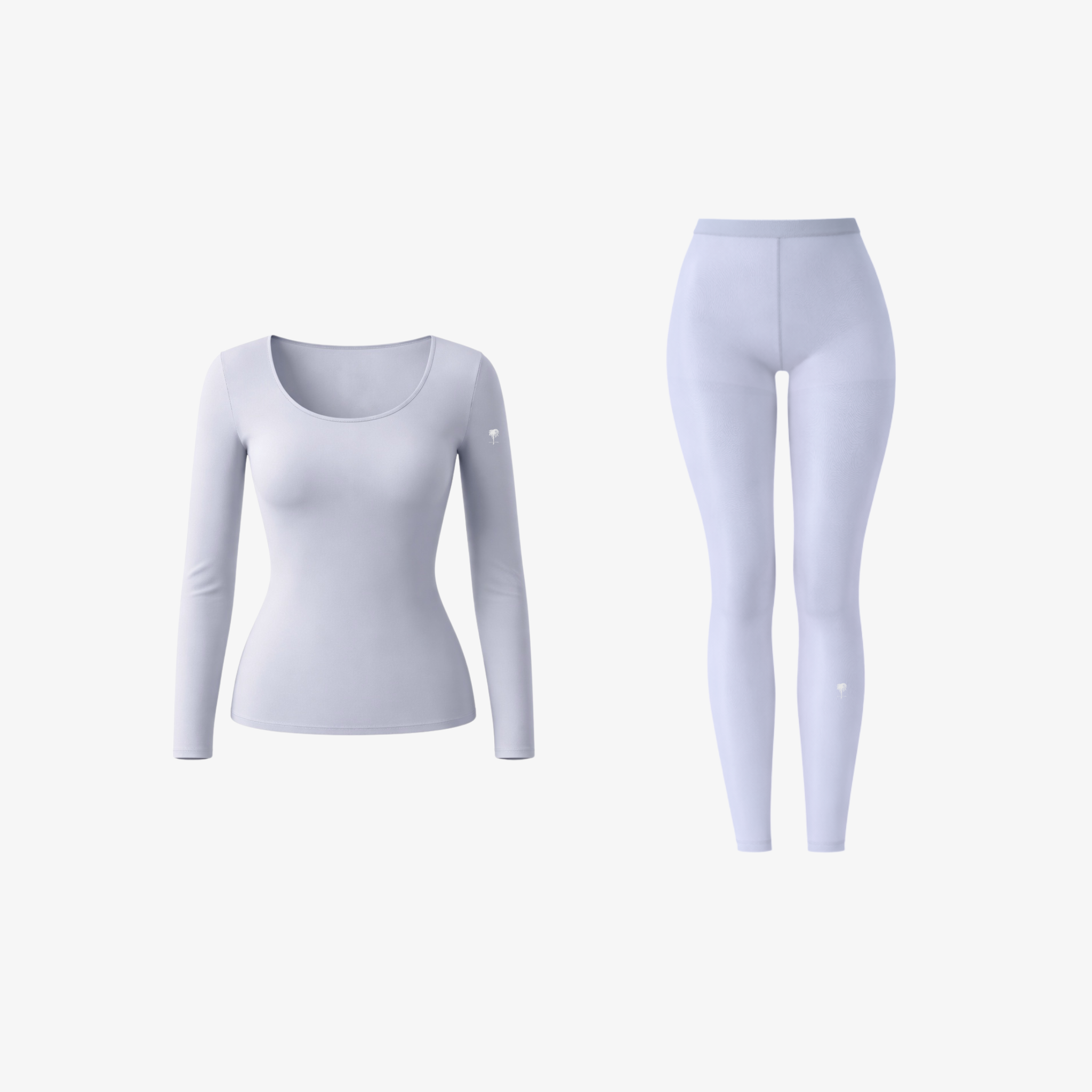 A crisp white seamless long-sleeve top and high-waisted leggings set, displayed on a white background with a small signature logo.