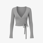 Muted Grey WrapLuxe™ top with soft drapes and sculpting stretch fabric, perfect for a studio-to-street look.