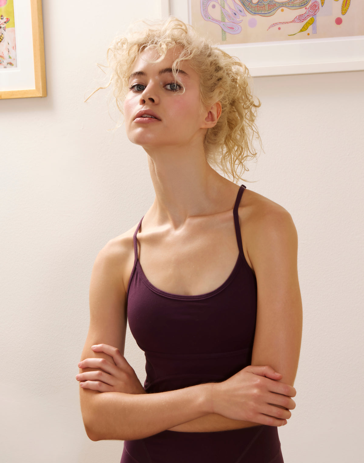 Blonde model wearing Deep Wine FormLine Bodysuit showing delicate thin straps and scoop neckline