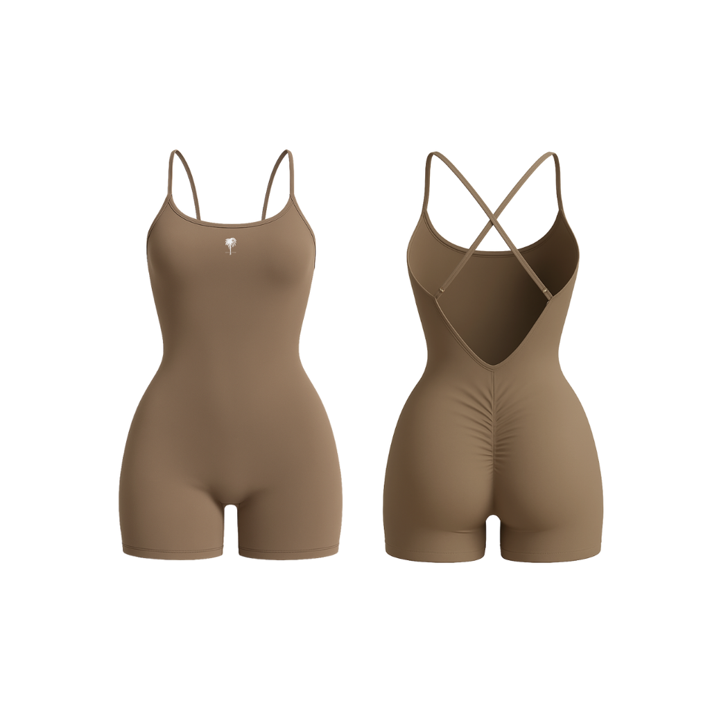 The Palm – BareForm™ Studio Romper in Coffee. A seamless one-piece with sculpting compression and a flattering scrunch back. Designed for movement and support with an open-back silhouette and soft cross-straps. Ultra-smooth, second-skin feel. Studio-ready.