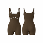 The Palm – BodyLinet™ Ribbed Bodysuit in brown. Sleek, sculpting one-piece with a ribbed texture and contrast trim, designed to contour the body and enhance natural curves. Ideal for layering or wearing solo, it combines support, style, and everyday versatility.
