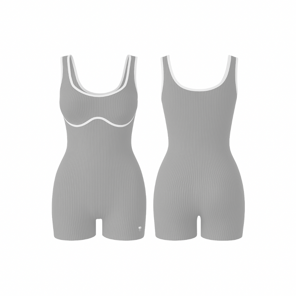 The Palm – BodyLinet™ Ribbed Bodysuit in stone-sculpt. Sleek, sculpting one-piece with a ribbed texture and contrast trim, designed to contour the body and enhance natural curves. Ideal for layering or wearing solo, it combines support, style, and everyday versatility.
