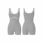 The Palm – BodyLinet™ Ribbed Bodysuit in stone-sculpt. Sleek, sculpting one-piece with a ribbed texture and contrast trim, designed to contour the body and enhance natural curves. Ideal for layering or wearing solo, it combines support, style, and everyday versatility.
