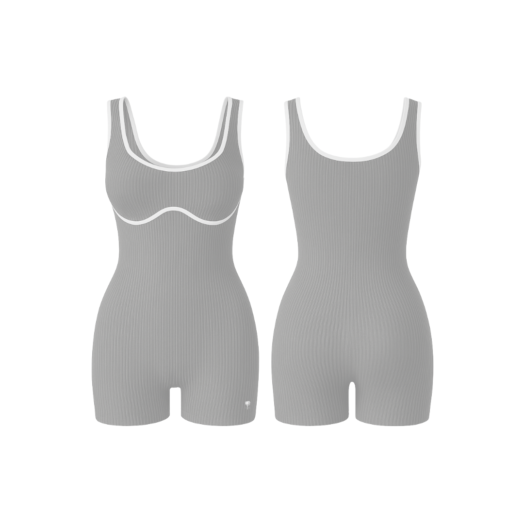 The Palm – BodyLinet™ Ribbed Bodysuit in stone-sculpt. Sleek, sculpting one-piece with a ribbed texture and contrast trim, designed to contour the body and enhance natural curves. Ideal for layering or wearing solo, it combines support, style, and everyday versatility.
