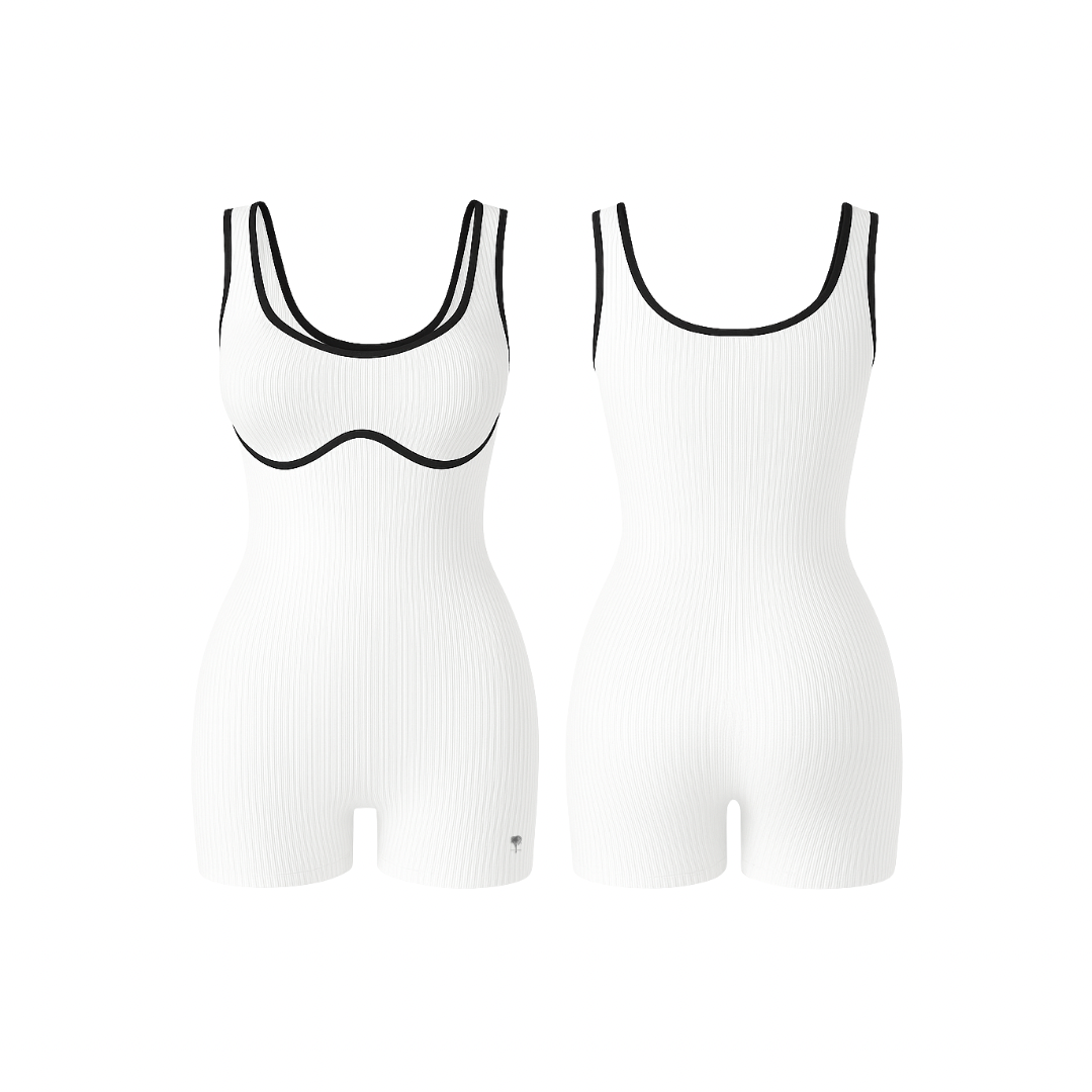 The Palm – BodyLinet™ Ribbed Bodysuit in white. Sleek, sculpting one-piece with a ribbed texture and contrast trim, designed to contour the body and enhance natural curves. Ideal for layering or wearing solo, it combines support, style, and everyday versatility.
