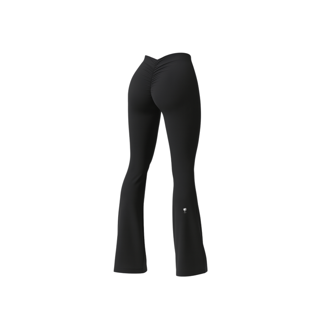 The Palm – BootyForm™ Flare in black. Sculpting high-waist leggings with scrunch detail and flared hem, designed to contour curves, elongate the legs and blend studio performance with everyday statement style.