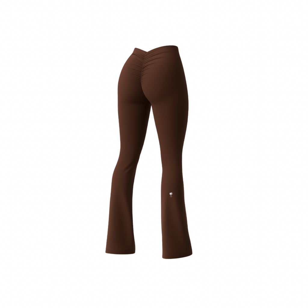 The Palm – BootyForm™ Flare in brown. High-waisted flared leggings with scrunch detail at the back, designed to sculpt and lift the glutes while elongating the legs. Crafted in stretch performance fabric for workouts or everyday wear.