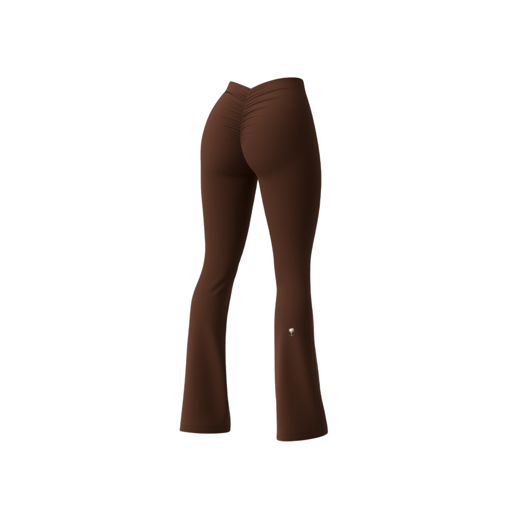 The Palm – BootyForm™ Flare in brown. High-waisted flared leggings with scrunch detail at the back, designed to sculpt and lift the glutes while elongating the legs. Crafted in stretch performance fabric for workouts or everyday wear.