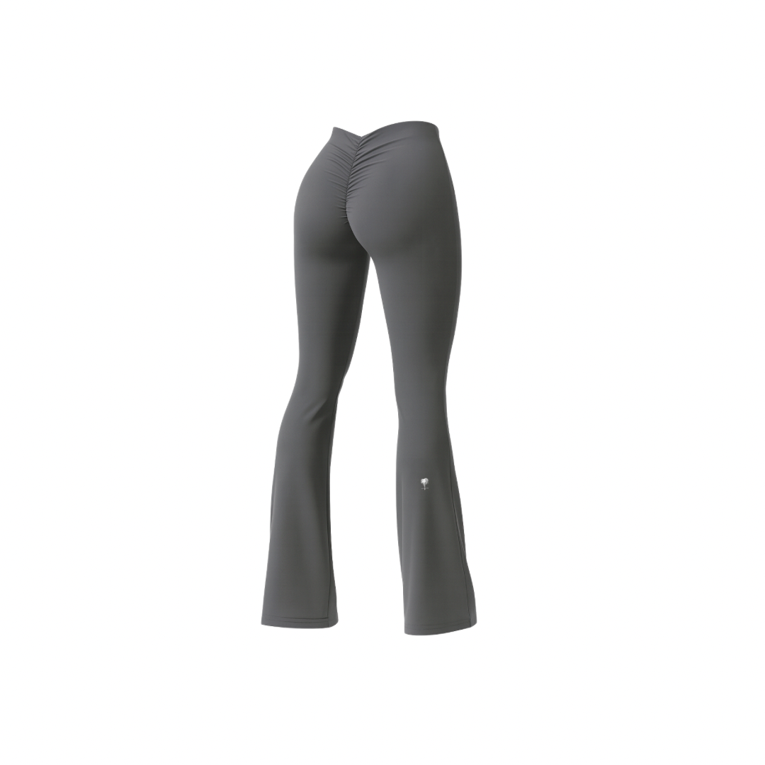 The Palm – BootyForm™ Flare in gray. Sculpting high-waisted leggings with scrunch-back detail and flared hem, designed to contour the body, elongate the legs and enhance natural curves.