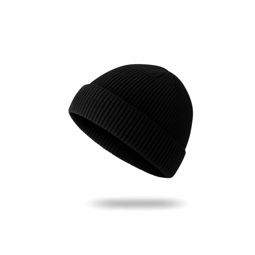 A soft rib-knit beanie from The Palm in jet black, designed for a cozy, close fit and everyday warmth. Clean minimalist silhouette with a folded cuff for elevated winter styling.