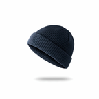 A soft rib-knit beanie from The Palm in deep navy, designed for a cozy, close fit and everyday warmth. Clean minimalist silhouette with a folded cuff for elevated winter styling.