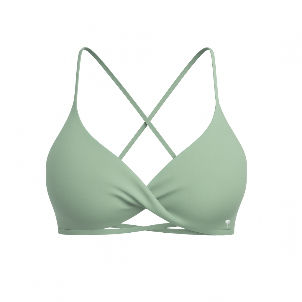 The Palm – CrossFlex™ Bra in mint green. Sleek scoop neckline with criss-cross straps and wrap front detail, designed for flexible support and a flattering fit.