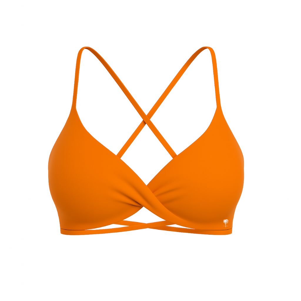 The Palm – CrossFlex™ Bra in orange. Sleek scoop neckline with criss-cross straps and wrap front detail, designed for flexible support and a flattering fit.