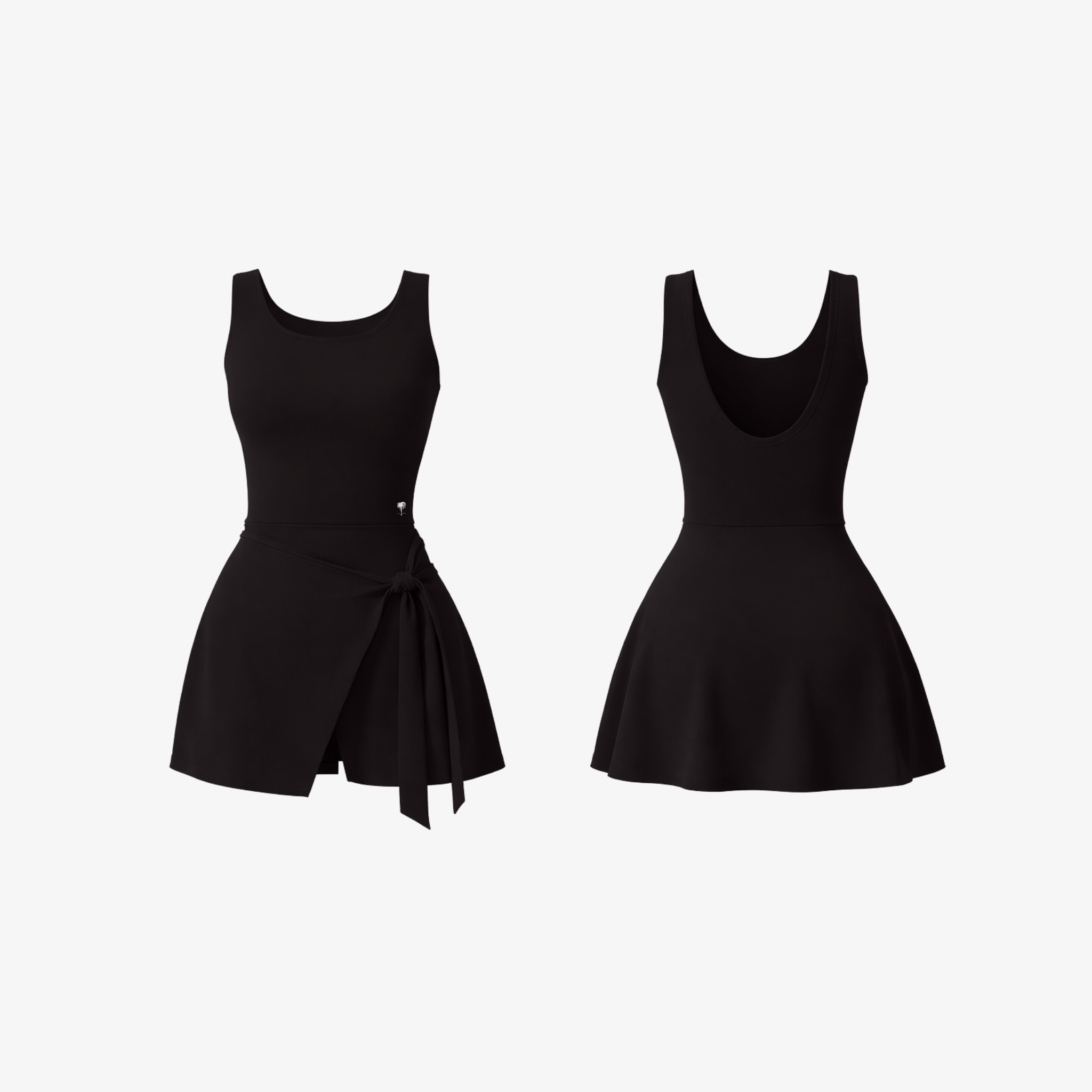 The Palm DrapeFit™ Wrap Romper in Black. A sleek activewear romper with built-in shorts, an elegant wrap skirt, and a sculpting fit that transitions effortlessly from workouts to everyday wear.