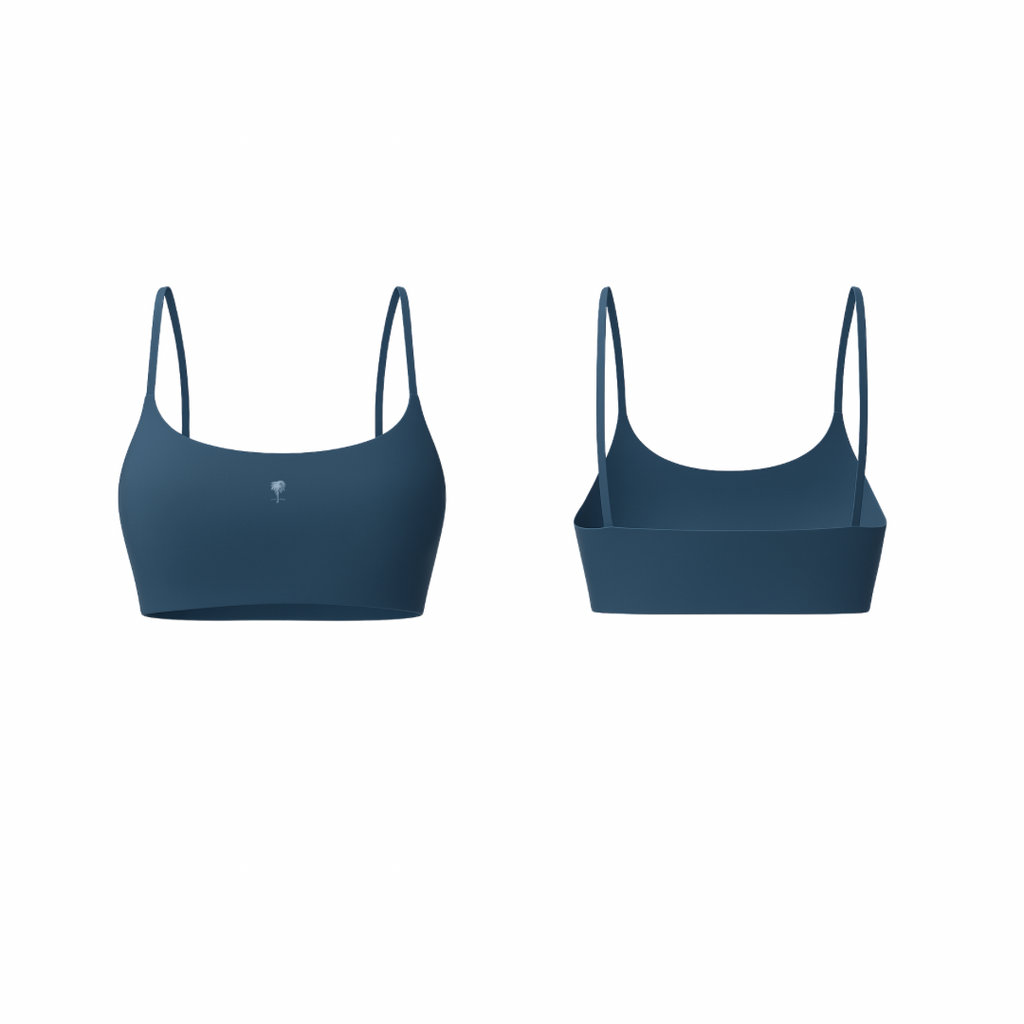 The Palm – FlexForm™ Bra in navy. Minimal seamless design with thin adjustable straps, supportive fit, and sleek scoop neckline.