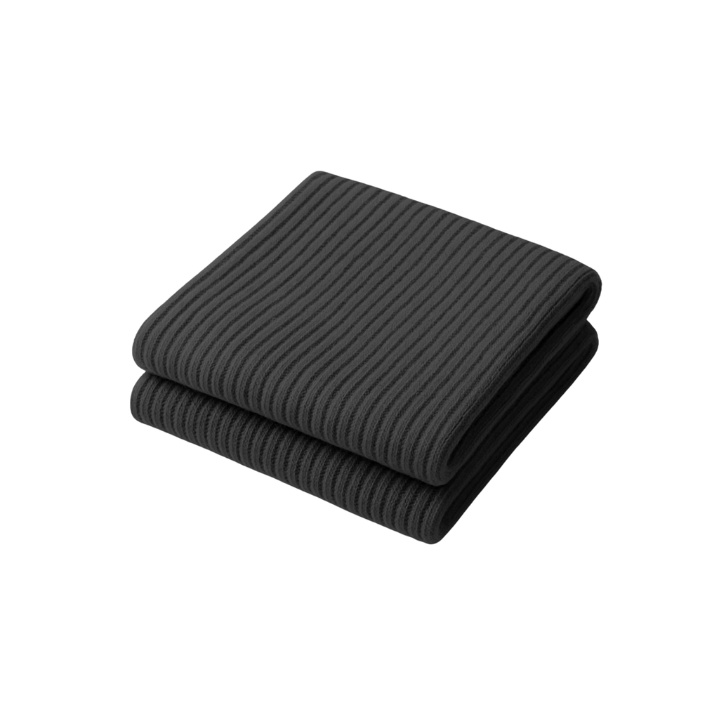 The Palm FlexLong™ Legwarmers in jet black 1, featuring a ribbed knit texture designed for comfortable stretch and minimal, cozy warmth.