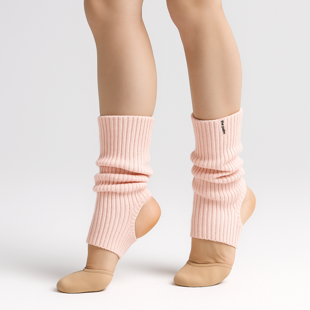 The Palm FlexLong™ Legwarmers in pale pink, featuring a ribbed knit texture designed for comfortable stretch and minimal, cozy warmth.