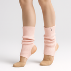The Palm FlexLong™ Legwarmers in pale pink, featuring a ribbed knit texture designed for comfortable stretch and minimal, cozy warmth.
