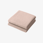 The Palm FlexWarm™ Legwarmers in Pale Pink. Soft ribbed knit leg warmers styled with heels, designed for studio layering and effortless elegance.
