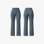 The Palm FlowFit™ Leggings in Blue-Grey. Sculpting high-rise silhouette in a cool-toned finish, crafted from smooth second-skin fabric with a fluid flared leg for effortless movement.