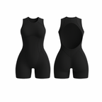The Palm FlowForm™ Open-Back Romper in black. Sleek one-piece activewear with a cut-out back, high neckline, and contouring seam lines. Designed with breathable, stretchy fabric for sculpting support and all-day comfort.