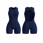 The Palm – FlowForm™ Open-Back Romper in navy blue. Sleek one-piece design with a sculpting fit, featuring an open-back cutout for breathability and style. Crafted from soft, seamless, four-way stretch fabric for movement, comfort, and a flattering silhouette.