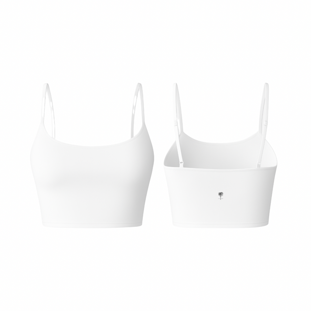 The Palm – PalmSoft™ Crop Top in classic white. Seamless minimalist design with thin adjustable straps and a smooth matte texture, offering light support and a soft, second-skin feel.