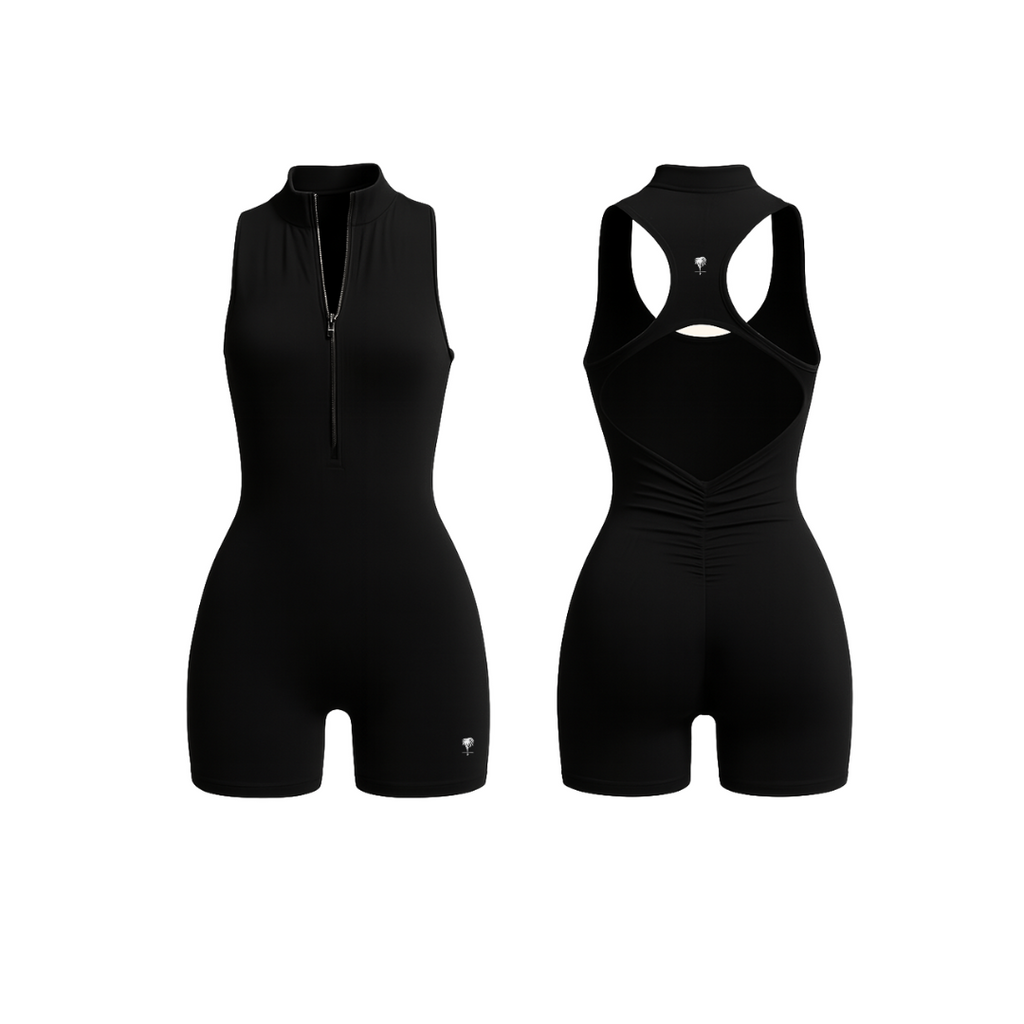 The Palm — SculptZip Romper in black. Sleek, high-neck romper with front zipper and racerback silhouette. Seamless second-skin fit designed to contour, lift, and move with you. Bold, minimal, iconic.