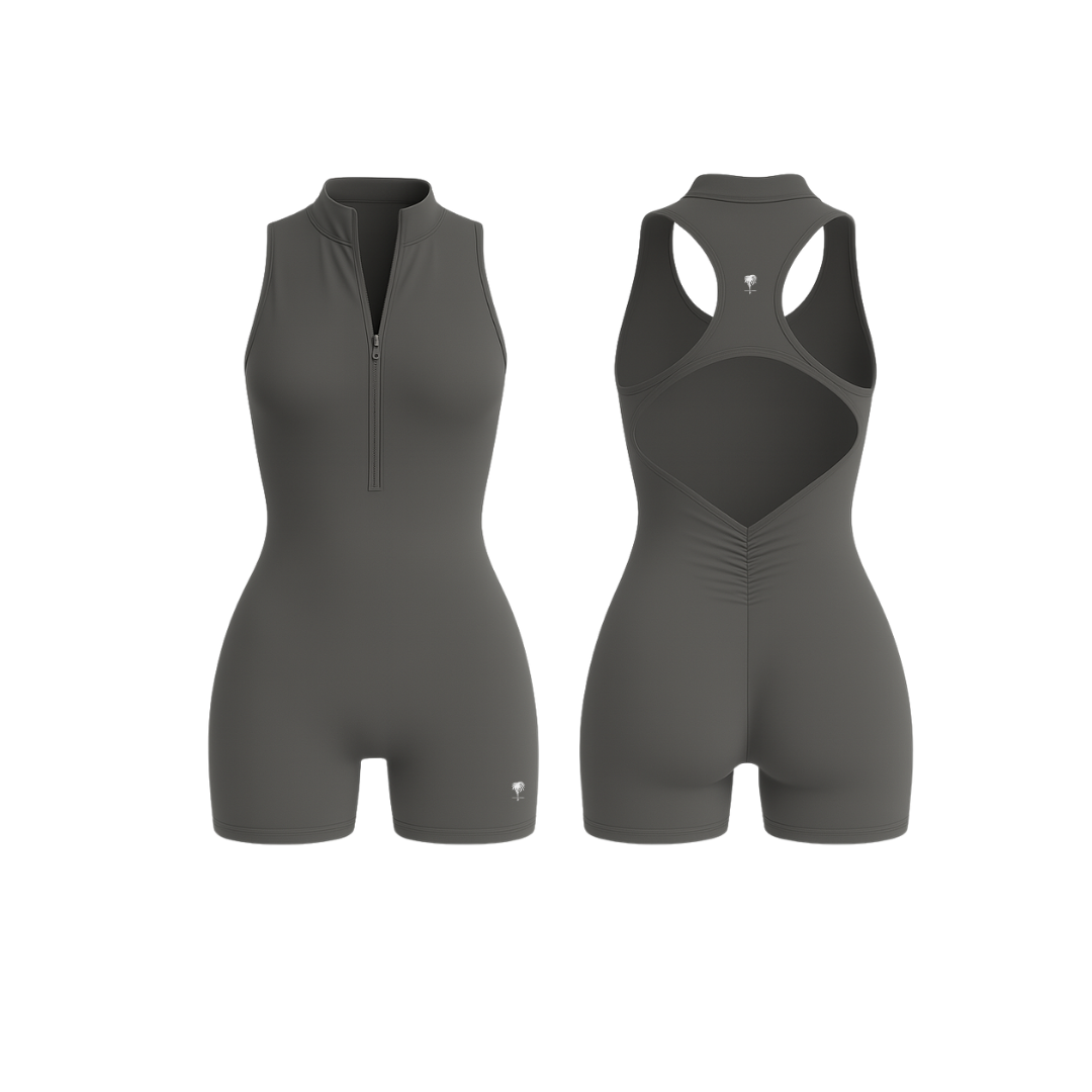 The Palm — SculptZip Romper in stone. Minimal, second-skin design with sculpting back seams and a functional front zipper. Seamless, breathable, and designed for confident, everyday wear.