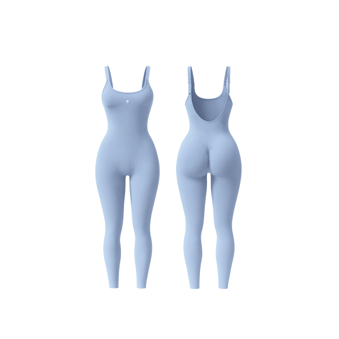 The Palm – ShapeFlex™ Suit in haze blue. Seamless full-length ribbed bodysuit with sculpting compression, four-way stretch, and second-skin fit. Designed to accentuate curves while allowing total freedom of movement, this versatile piece transitions effortlessly from studio to street with moisture-wicking fabric and a sleek, contour-hugging silhouette.