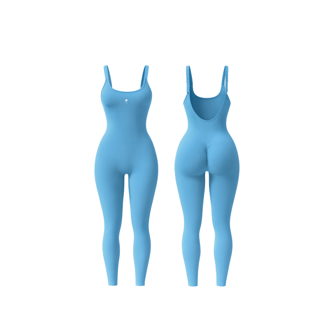 The Palm – ShapeFlex™ Suit in sky blue. Seamless full-length ribbed bodysuit with sculpting compression, four-way stretch, and second-skin fit. Designed to accentuate curves while allowing total freedom of movement, this versatile piece transitions effortlessly from studio to street with moisture-wicking fabric and a sleek, contour-hugging silhouette.
