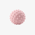 The Palm SoftRoll™ Recovery Ball in soft pink. Textured wellness ball designed for muscle recovery, foot massage, mobility routines, and everyday relaxation.