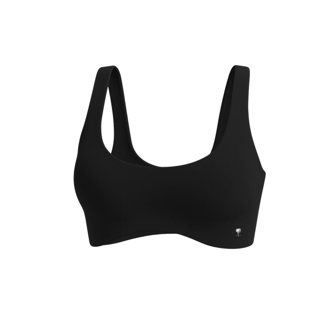 The Palm — SoftSculpt Bra in black. Seamless, second-skin feel with a flattering scoop neckline and wide straps for natural lift and support. Soft, minimal, and made to move with you.