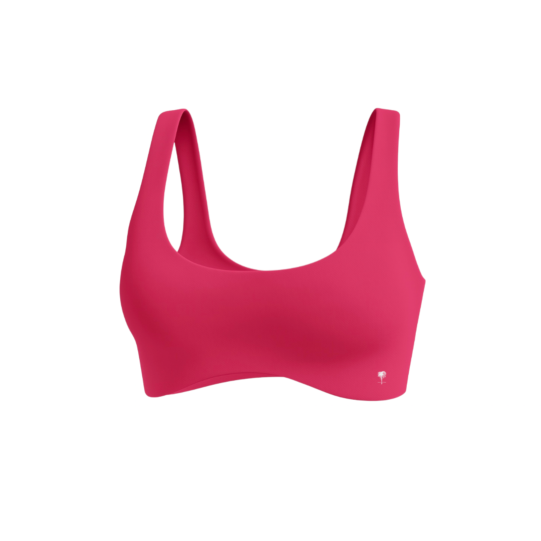 The Palm — SoftSculpt Bra in hot pink. Designed to sculpt and lift with a second-skin fit, flattering scoop neckline, and wide straps. Bold, seamless, and made to move.