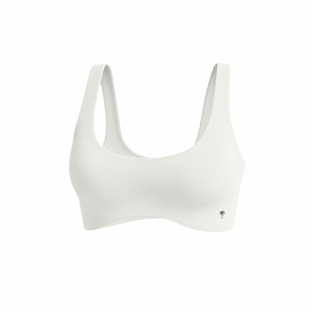 The Palm — SoftSculpt Bra in white. Seamless, second-skin feel with flattering scoop neckline and wide straps for natural lift and support. Minimal, breathable, and designed to move with you.