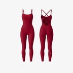 StrapSculpt™ Jumpsuit by The Palm in Deep Red. A sculpting, breathable nylon-spandex one-piece with delicate spaghetti straps and an open cross-back design, crafted for a smooth, elongated silhouette.
