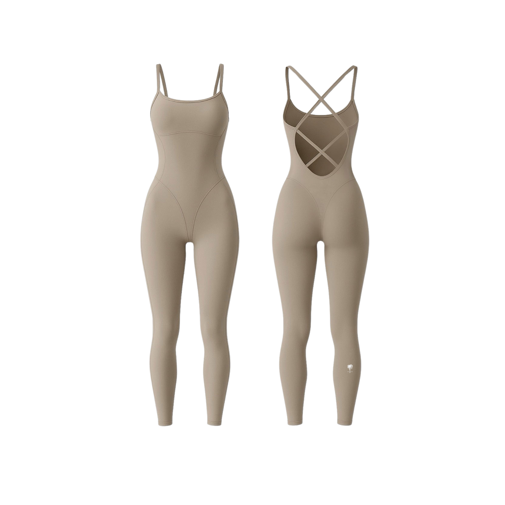 The Palm StrapSculpt™ Jumpsuit in soft beige, featuring a contoured fit, sculpting seams, and criss-cross back straps. A sleek, body-hugging silhouette designed for everyday movement and elevated comfort.